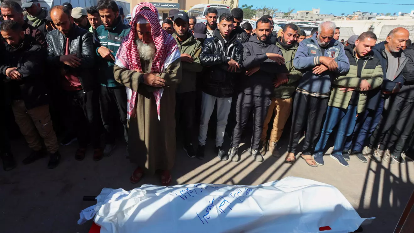Mourners perform funeral prayers for senior Hamas police officer Mahmoud Al-Astal, who was killed on Monday, at Nasser Hospital in Khan Younis, southern Gaza Strip, January 12, 2026. Reuters/Ramadan Abed