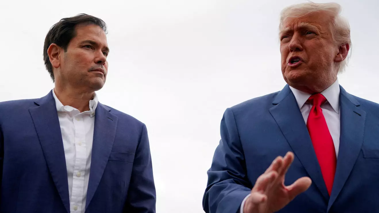 U.S. President Donald Trump stands with U.S. Secretary of State Marco Rubio as he prepares to depart for Hagerstown, Maryland, at Morristown Municipal Airport in Morristown, New Jersey, U.S., June 8, 2025. Reuters/Nathan Howard