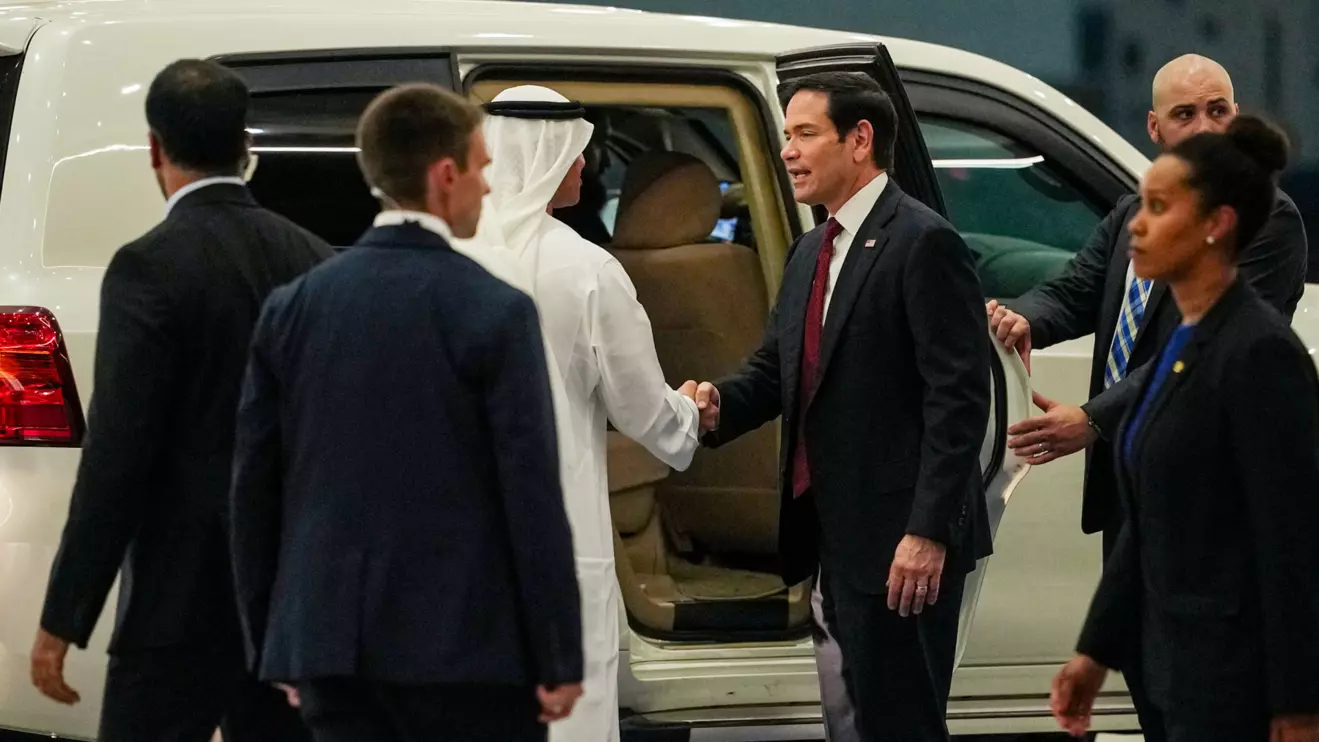 UAE Ambassador to the U.S. Yousef Al Otaiba shakes hands with U.S. Secretary of State Marco Rubio upon his arrival at Al Bateen Executive Airport to discuss the interim deal between the U.S. and Iran with Arab Gulf allies, in Abu Dhabi, United Arab Emirates, June 23, 2026. Reuters/Eric Lee