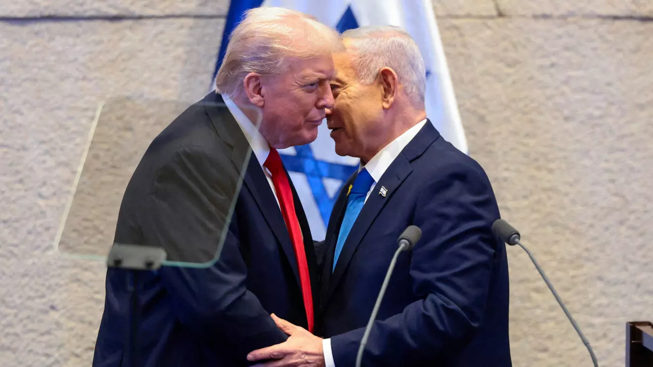 U.S. President Donald Trump and Israeli Prime Minister Benjamin Netanyahu stand at the Knesset on the day Trump addresses it, amid a U.S.-brokered prisoner-hostage swap and ceasefire deal between Israel and Hamas, in Jerusalem, October 13, 2025. Reuters/Evelyn Hockstein