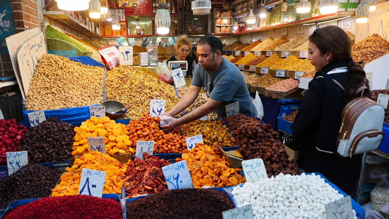 Iranian women shop in a store at the Tehran Bazaar after the approval of the bill to remove four zeros from the national currency, in Tehran, Iran, October 5, 2025. Majid Asgaripour/WANA (West Asia News Agency) via Reuters