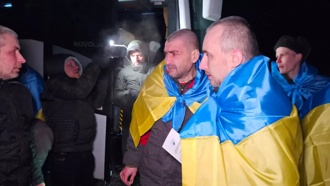 Ukrainian prisoners of war (POWs) react after a swap, amid Russia's attack on Ukraine, at an unknown location in Ukraine, in this handout picture released January 3, 2024. Ukrainian Armed Forces/Coordination Headquarters for the Treatment of Prisoners of War/Handout via Reuters