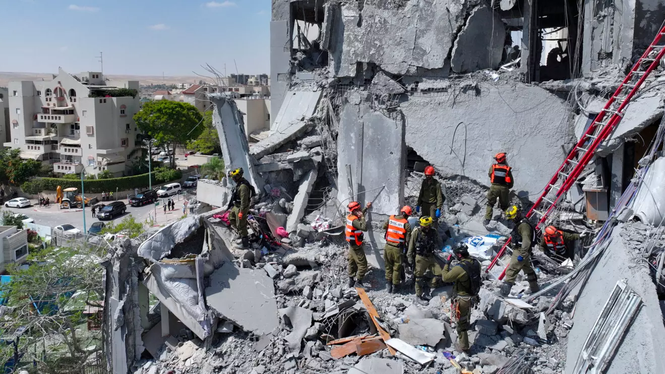 A drone view shows emergency personnel working at an impacted residential site, following an early morning missile attack from Iran on Israel, in Be'er Sheva, Israel June 24, 2025. ReutersYonatan Honig