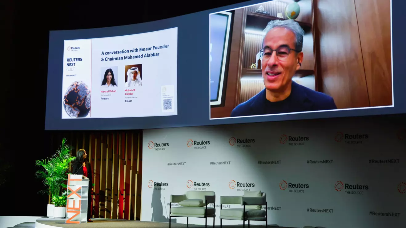 Reuters Gulf Bureau Chief Maha el Dahan speaks with Emaar Founder and Chairman Mohamed Alabbar as he appears on-screen at the Reuters NEXT Gulf Summit, in Abu Dhabi, United Arab Emirates, October 22, 2025. Reuters/Rula Rouhana