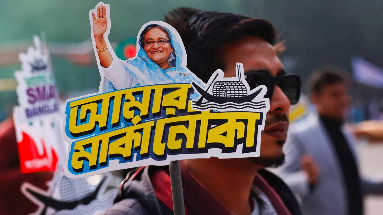A student holds a placard of Prime Minister Sheikh Hasina as they celebrate the formation day of Bangladesh Chhatra League, the student wing of Bangladesh Awami League, at the University of Dhaka, ahead of the general election in Dhaka, Bangladesh, January 4, 2024. Reuters/Mohammad Ponir Hossain