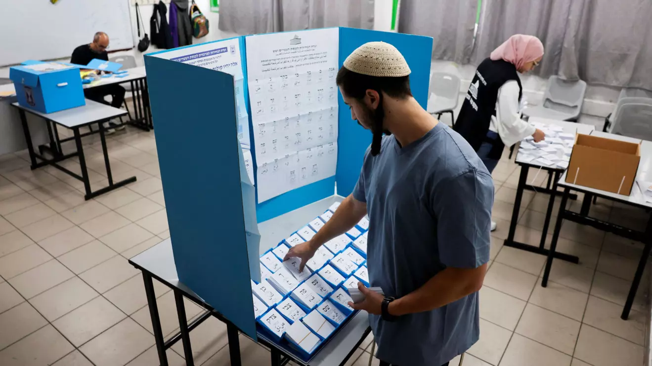 Workers prepare a polling station as the country holds a national election, in the Arab city of Umm al-Fahm, northern Israel, October 27, 2026. euters/Ammar Awad