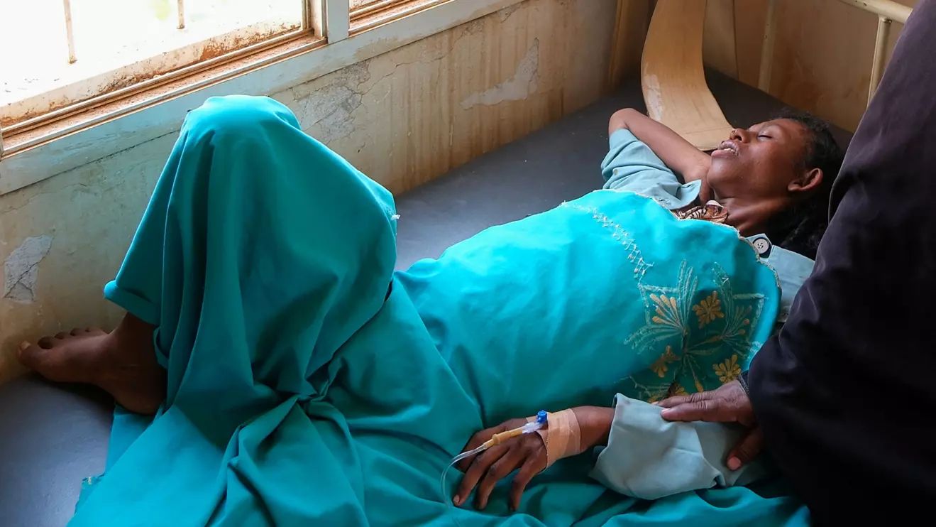 A Sudanese woman lies in a bed as she receives treatment for dengue fever at Omdurman Hospital, as Sudan grapples with outbreaks of dengue and cholera amid the annual rainy season and a collapsed healthcare and infrastructure system, in Khartoum, Sudan, September 22, 2025. Reuters/El Tayeb Siddig