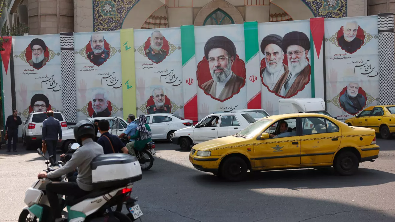 People drive next to a banner with a picture of Iran's Supreme Leader Mojtaba Khamenei, on a street in Tehran, Iran, October 28, 2026. Majid Asgaripour/WANA (West Asia News Agency) via Reuters
