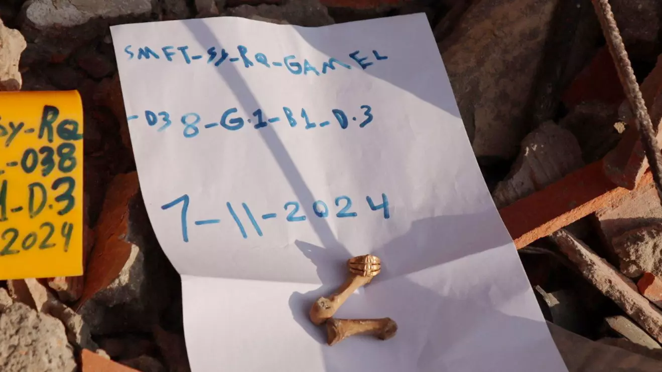 A ring is seen on a finger bone at the collapsed Jakkak Building in Raqqa, Syria, in November 7, 2024, according to SJAC. Syria Justice and Accountability Centre/Handout via Reuters