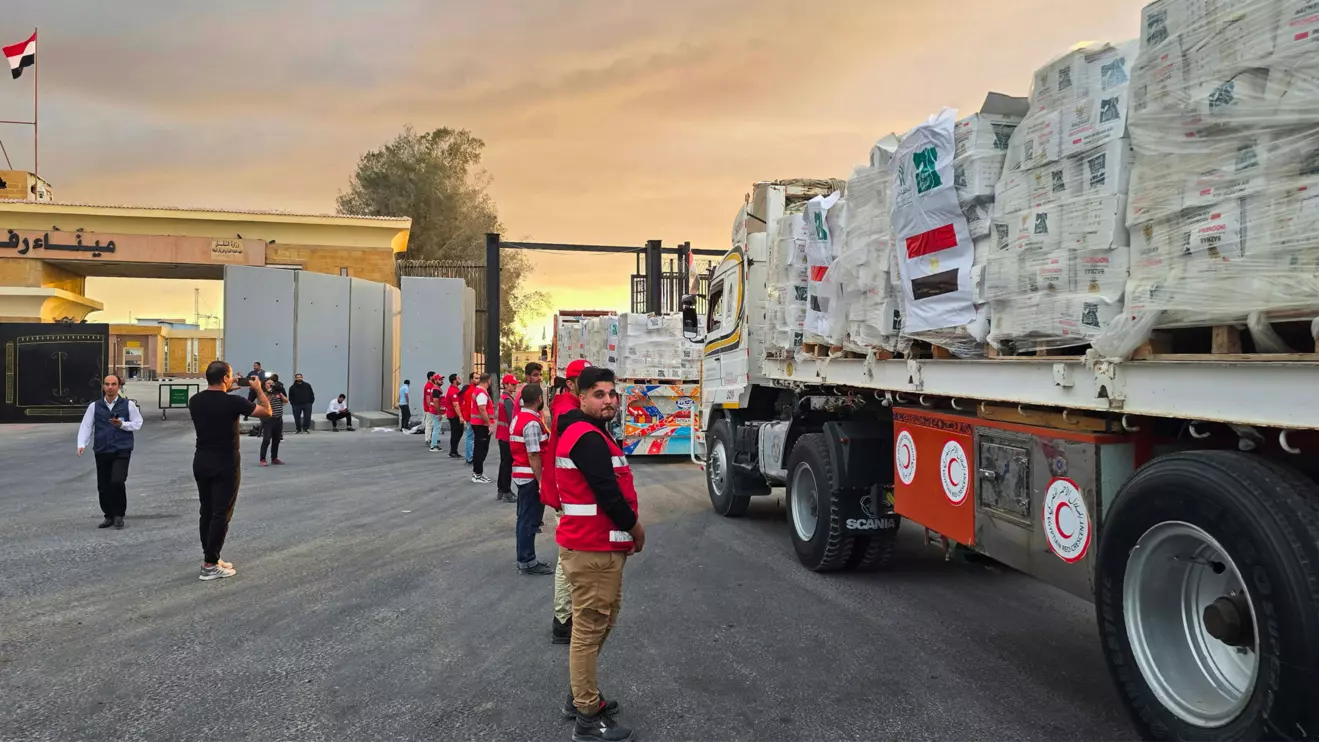 Trucks carrying aid bound for Gaza cross the border crossing between Egypt and the Gaza Strip, after a ceasefire between Israel and Hamas in Gaza went into effect, in Rafah, Egypt, October 12, 2025, Reuters
