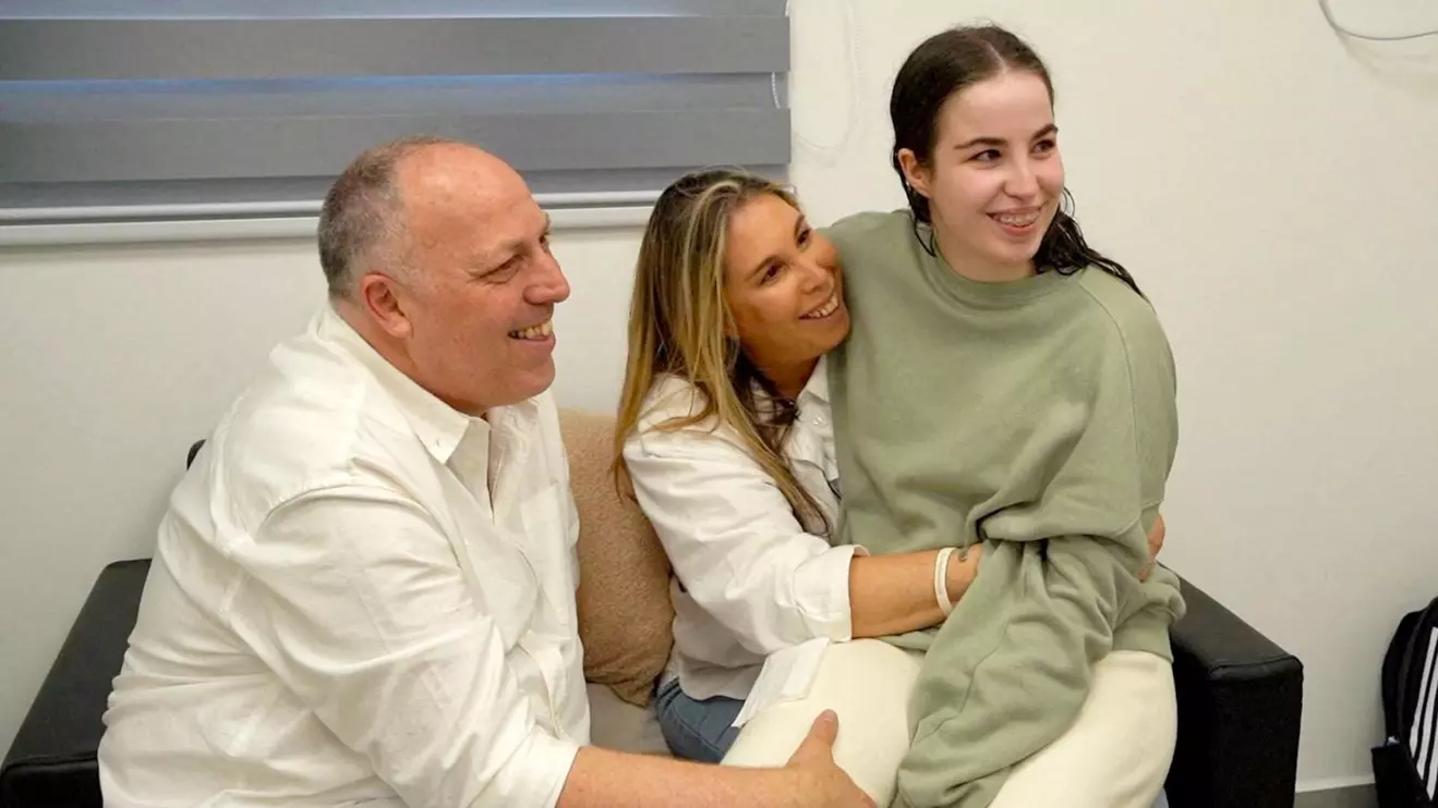 Released Israeli hostage, Agam Berger, a soldier who was seized from her army base in southern Israel during the deadly October 7 2023 attack by Hamas, is reunited with her parents following her release, in a handout photo obtained by Reuters on January 30, 2025. Israel Defense Forces