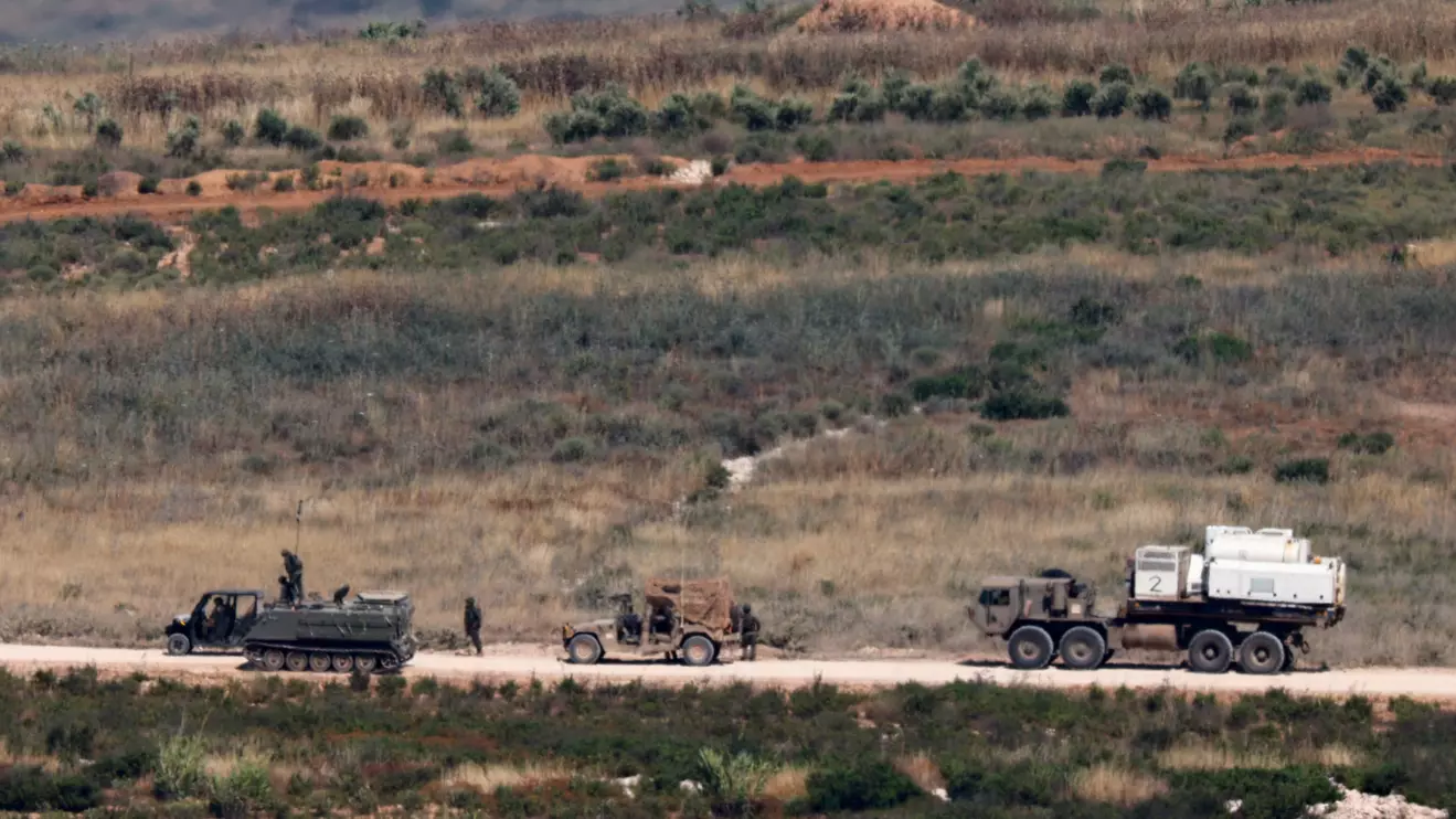 Israeli soldiers near military vehicles in Lebanon, as seen from the Israeli side of the Israeli-Lebanese border, June 1, 2026. Reuters/Amir Cohen