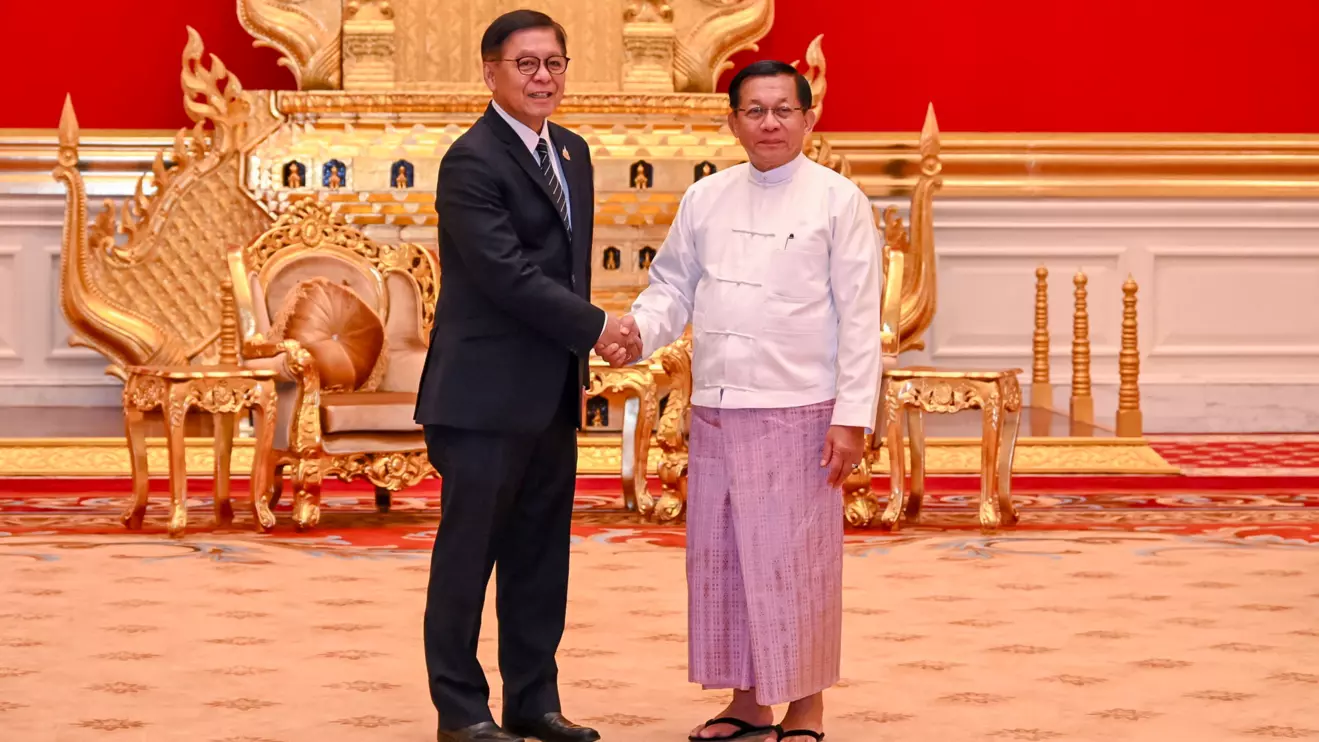 Thailand's Deputy Prime Minister and Foreign Minister Sihasak Phuangketkeow shakes hands with Myanmar President Min Aung Hlaing during their meeting in Naypyitaw, Myanmar, April 22, 2026. Thailand's Ministry of Foreign Affairs