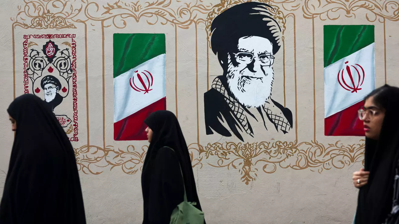 People walk by a mural depicting Iran's late Supreme Leader Ayatollah Ali Khamenei, on a street in Tehran, Iran, August 13, 2026. Majid Asgaripour/WANA (West Asia News Agency) via Reuters