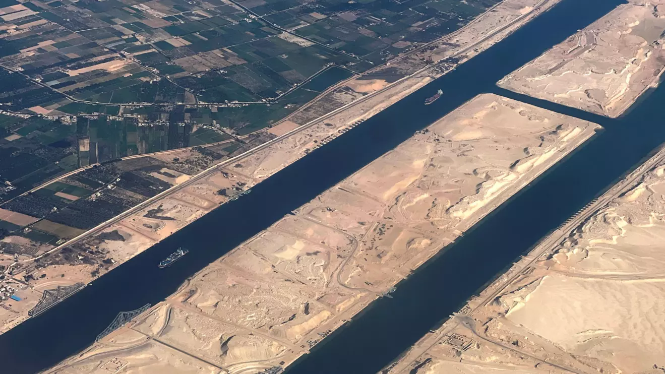 Ships are seen from a plane window, passing through the Suez Canal, Egypt, Reuters/Mohamed Abd El Ghany