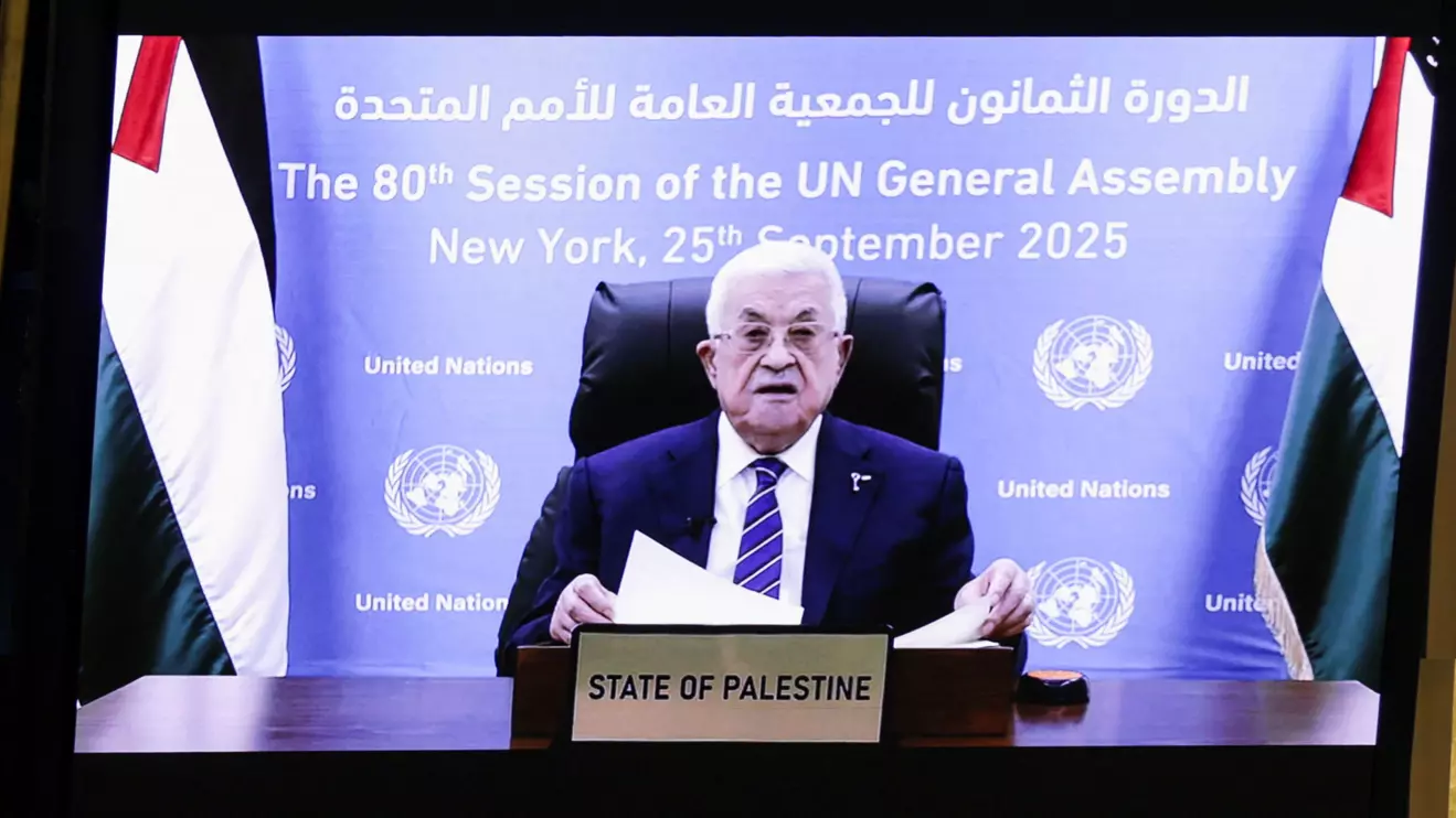 Palestinian President Mahmoud Abbas appears on screens as he addresses the 80th United Nations General Assembly (UNGA), at the U.N. headquarters in New York, U.S., September 25, 2025. Reuters/Jeenah Moon