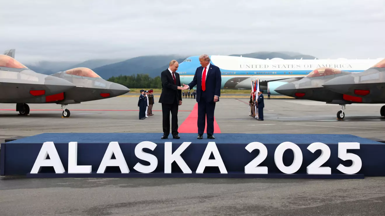 U.S. President Donald Trump goes to shake hands with Russian President Vladimir Putin, as they meet to negotiate for an end to the war in Ukraine, at Joint Base Elmendorf-Richardson in Anchorage, Alaska, U.S., August 15, 2025. Reuters/Kevin Lamarque