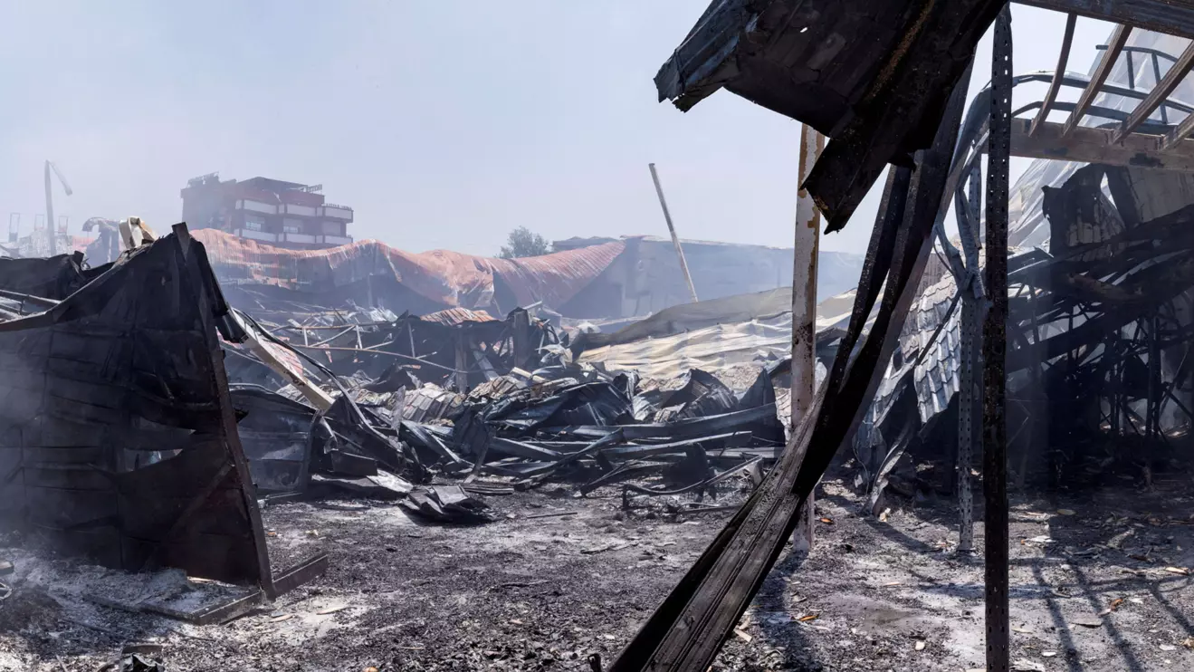 Smoke rises from a burnt shopping complex that was looted during protests over frequent power outages and water shortages, in Antananarivo, Madagascar September 26, 2025. Reuters/Zo Andrianjaf