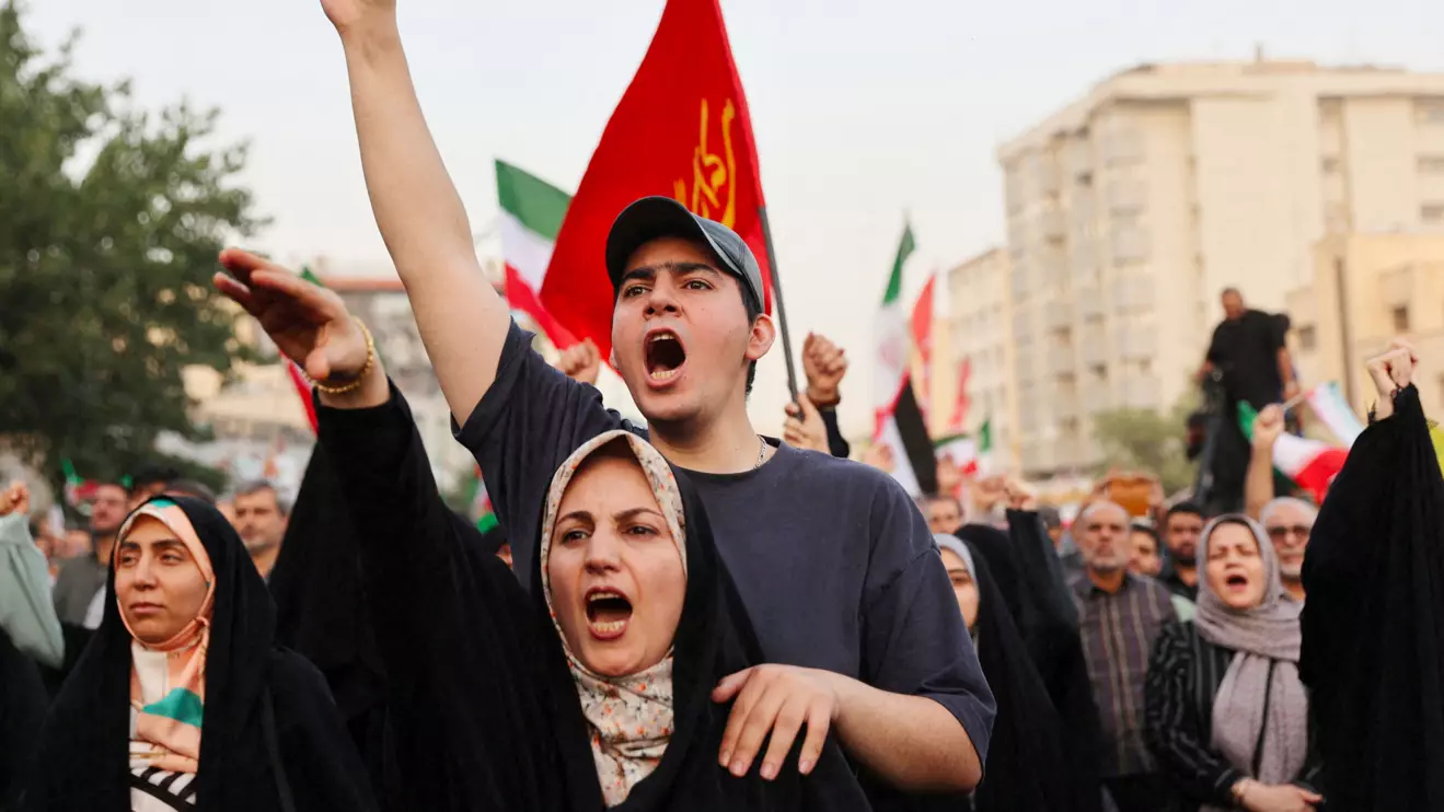 People gesture as they attend a gathering to support Iran's Armed Forces, after U.S. President Donald Trump announced a ceasefire between Israel and Iran, in Tehran, Iran, June 24, 2025. Majid Asgaripour/WANA (West Asia News Agency) via Reuters