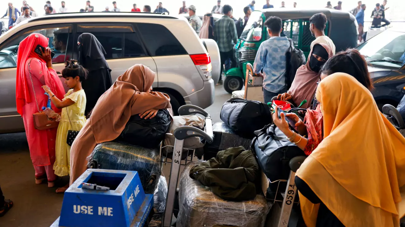 Stranded passengers wait at Hazrat Shahjalal International Airport after flights to Dubai and Bahrain were cancelled after Iranian strikes, following strikes on Iran launched by the United States and Israel, in Dhaka, Bangladesh, March 1, 2026. Reuters/Mohammad Ponir Hossain