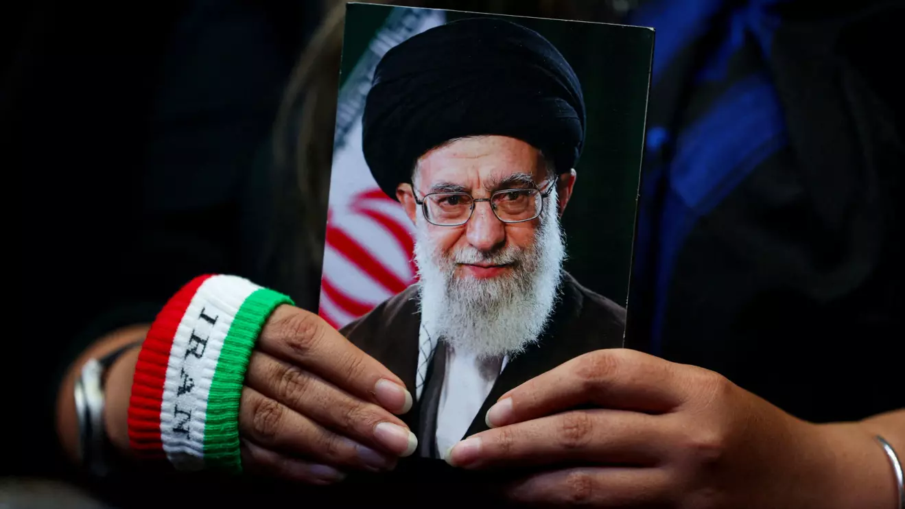A woman holds an image of late Iranian Supreme Leader Ayatollah Ali Khamenei during a rally in Tehran, Iran, May 29, 2026. Majid Asgaripour/WANA (West Asia News Agency) via Reuters