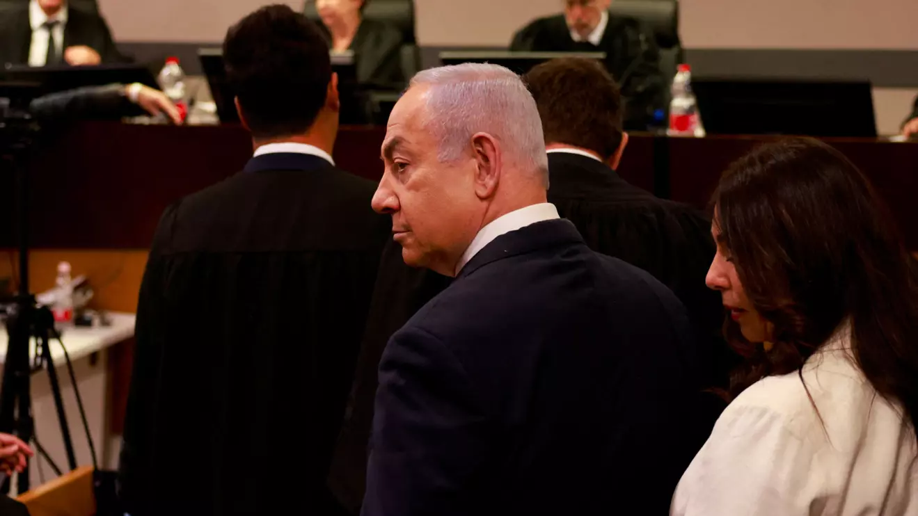 Israeli Prime Minister Benjamin Netanyahu enters the district court in Tel Aviv at the start of his hearing on corruption charges on December 10, 2024, Menahem Kahana/Reuters