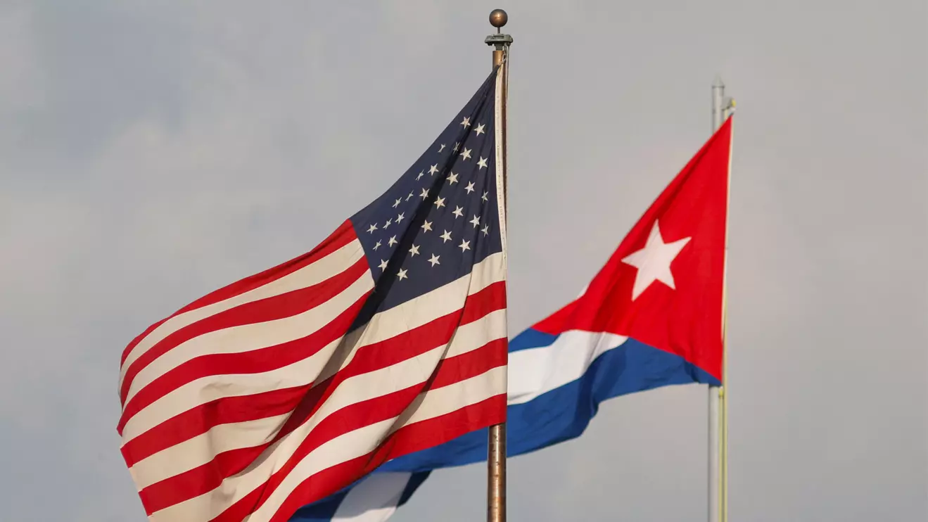 A view of Cuban and U.S. flags beside the U.S. Embassy in Havana, Cuba, Reuters/Alexandre Meneghini