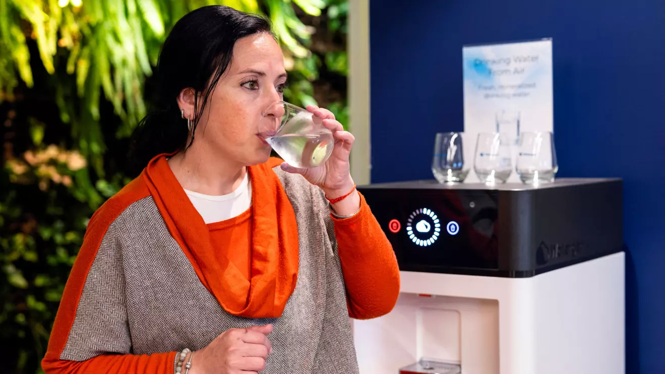 A worker tastes drinking water, that has been extracted from the air, at the office of Watergen, in Petah Tikva, Israel March 27, 2024. Reuters/Amir Cohen