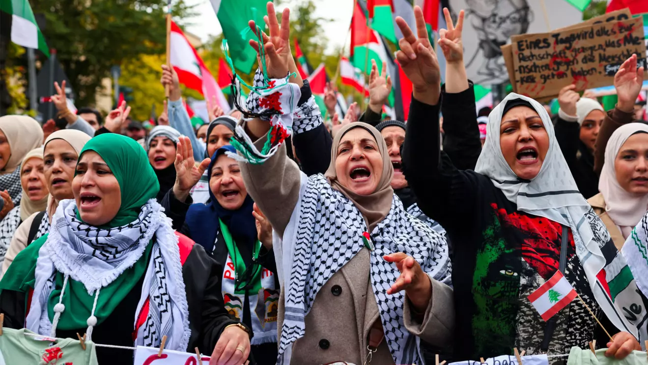 Protesters react holding Lebanese and Palestinian flags during a demonstration in solidarity with Palestinians in Gaza, ahead of the October 7 attack anniversary, amid the Israel-Hamas conflict, in Berlin, Germany, October 5, 2024. Reuters/Christian Mang