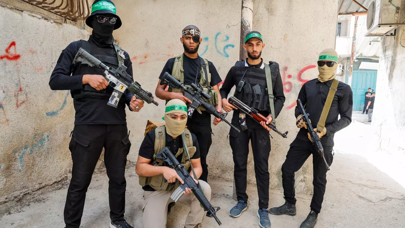 Palestinian militants hold weapons on the day of the funeral of Palestinian militant, Ahmed Abu al-Foul, who was killed by Palestinian Authority forces in Tulkarm camp, in the Israeli-occupied West Bank, May 2, 2024. Reuters/Raneen Sawafta