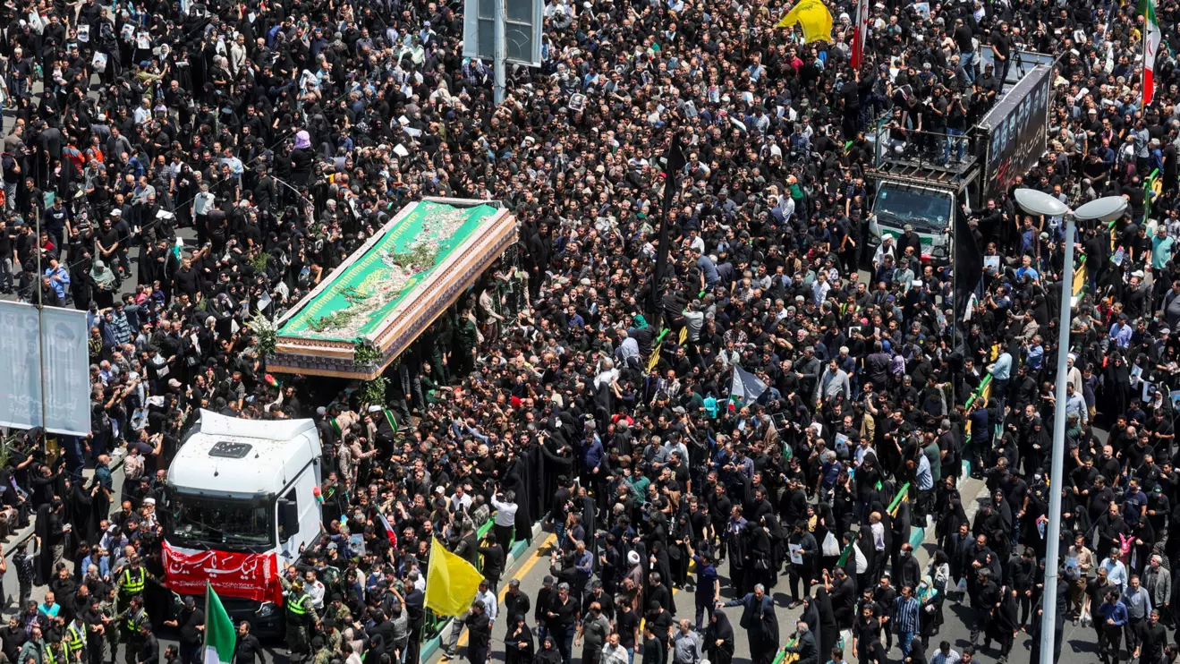 Mourners attend the funeral for victims of the helicopter crash that killed Iran's President Ebrahim Raisi, Foreign Minister Hossein Amirabdollahian and others, in Tehran, Iran, May 22, 2024. Majid Asgaripour/WANA (West Asia News Agency) via Reuters