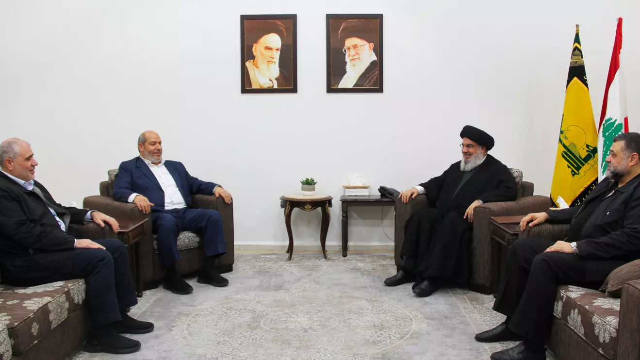 Lebanon's Hezbollah leader Sayyed Hassan Nasrallah meets with top Hamas official Khalil Al-Hayya in this handout picture obtained by Reuters on July 5, 2024, Lebanon. Hezbollah Media Office/Handout via Reuters