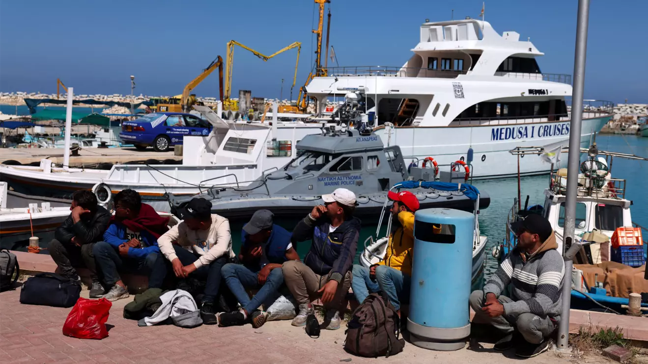 Migrants wait at a fishing shelter in Paralimni, Cyprus, April 5, 2024. This week the island has seen un unprecedented influx of hundreds of refugees from Syria, whom Cypriot authorities said set off from the coast of Lebanon. Reuters/Yiannis Kourtoglou