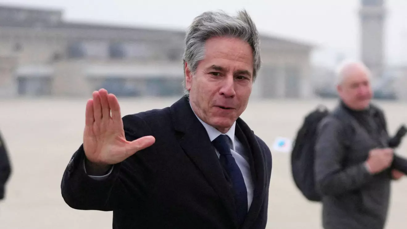U.S. Secretary of State Antony Blinken waves before he boards a plane at the Osan Air Base, in Pyeongtaek, South Korea, Monday, Jan. 6, 2025. Lee Jin-man/Reuters