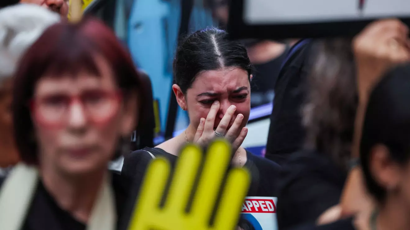 A woman reacts as she takes part in a march towards Israeli Prime Minister Benjamin Netanyahu's private residence, to mark one year since the deadly October 7 attack by Hamas, in Jerusalem, October 7, 2024. Reuters/Ronen Zvulun