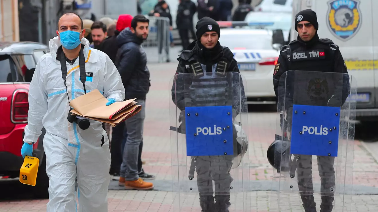 A police forensic expert examines as Turkish police stand guard outside the Italian Santa Maria Catholic Church after two masked gunmen were shooting during Sunday service, in Istanbul, Turkey January 28, 2024. Reuters/Dilara Senkaya