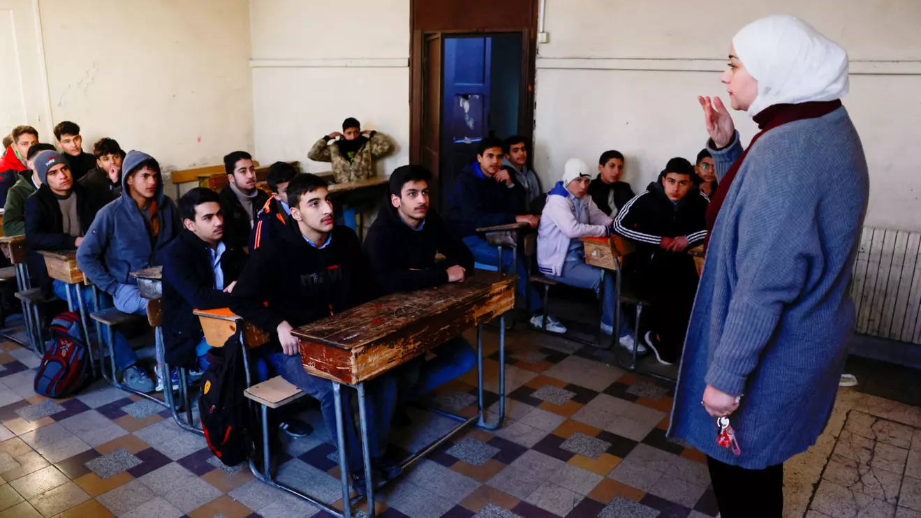 Students sit in a classroom at a school in the early morning following an announcement of the reopening of schools by the authorities, after fighters of the ruling Syrian body ousted Syria's Bashar al-Assad, in Damascus, Syria December 15, 2024. Reuters/Ammar Awad