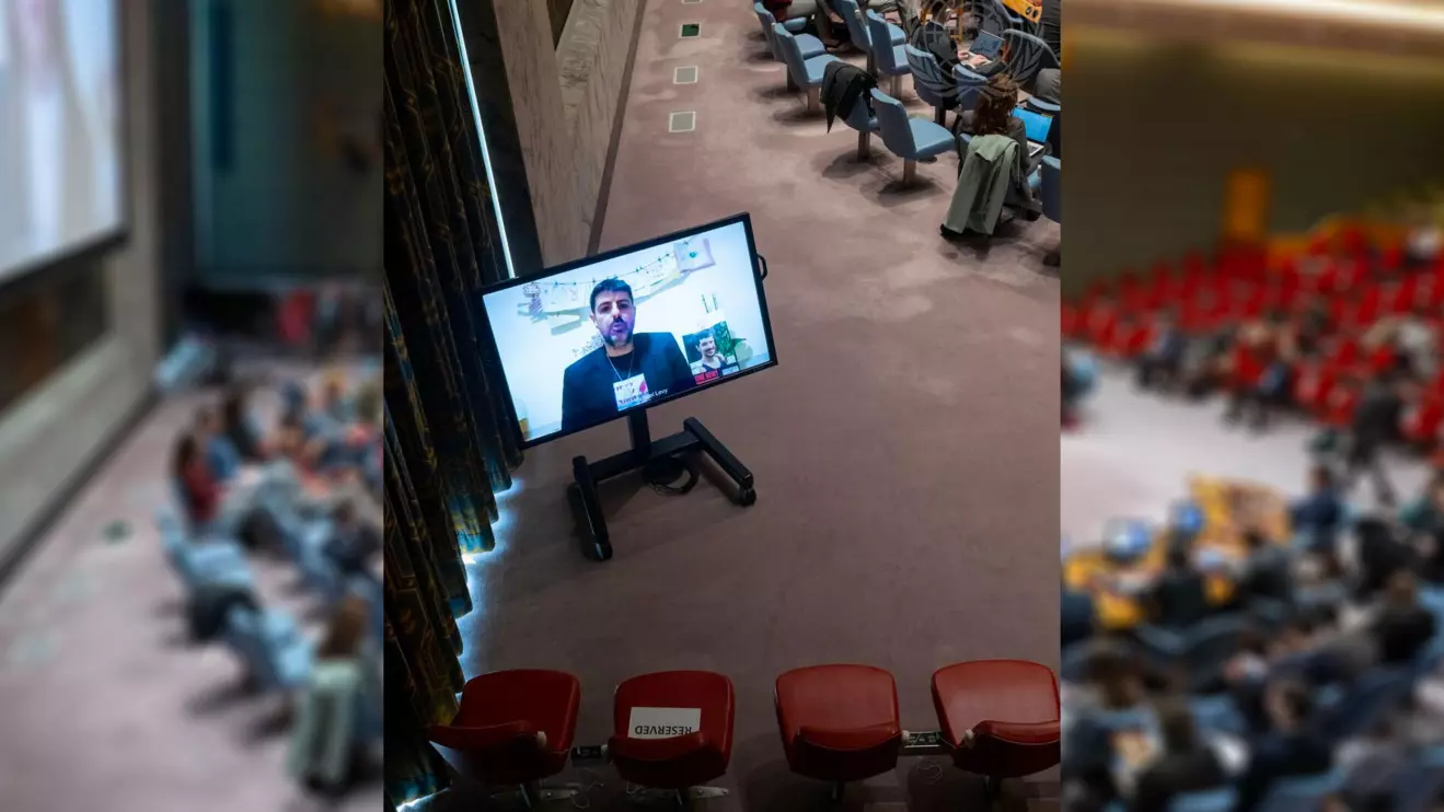 Michael Levy (on screen), brother of Or Levy, an Israeli hostage, addresses the Security Council meeting on the situation in the Middle East © UN