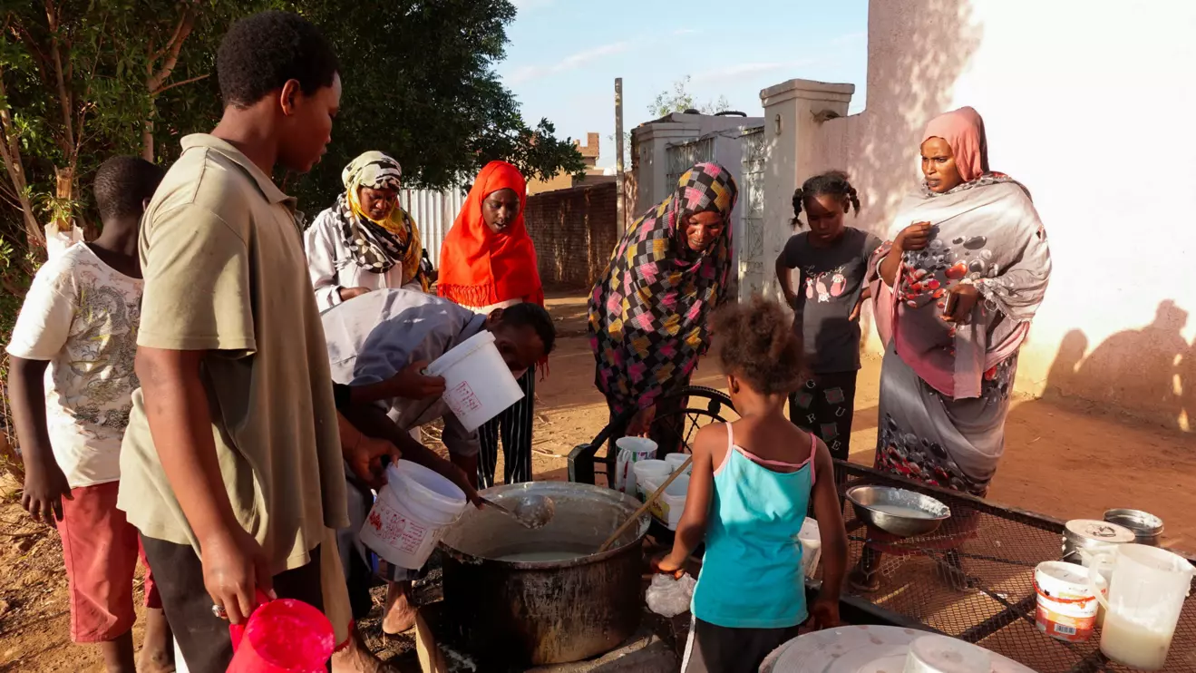 Displaced Sudanese families wait to receive food from a charity kitchen, as a year of war between Sudan's army and the paramilitary Rapid Support Forces (RSF) has driven more than 8.5 million people from their homes, in the city of Omdurman, Sudan, April 6, 2024. Reuters/El Tayeb Siddig