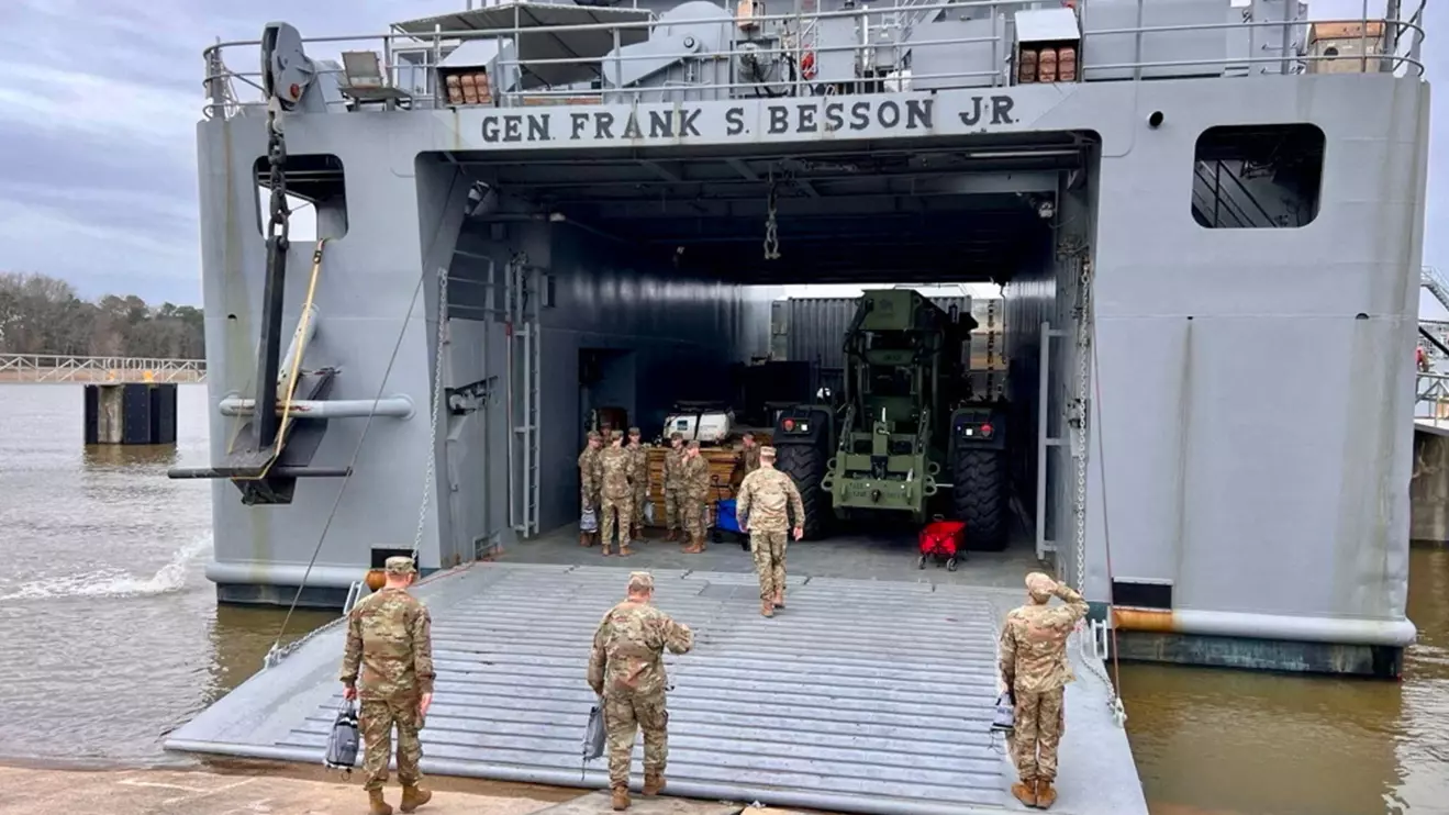 Personnel board the U.S. Army Vessel (USAV) General Frank S. Besson (LSV-1) from the 7th Transportation Brigade (Expeditionary), 3rd Expeditionary Sustainment Command, XVIII Airborne Corps as it departs en route to the Eastern Mediterranean, US CENTCOM via X