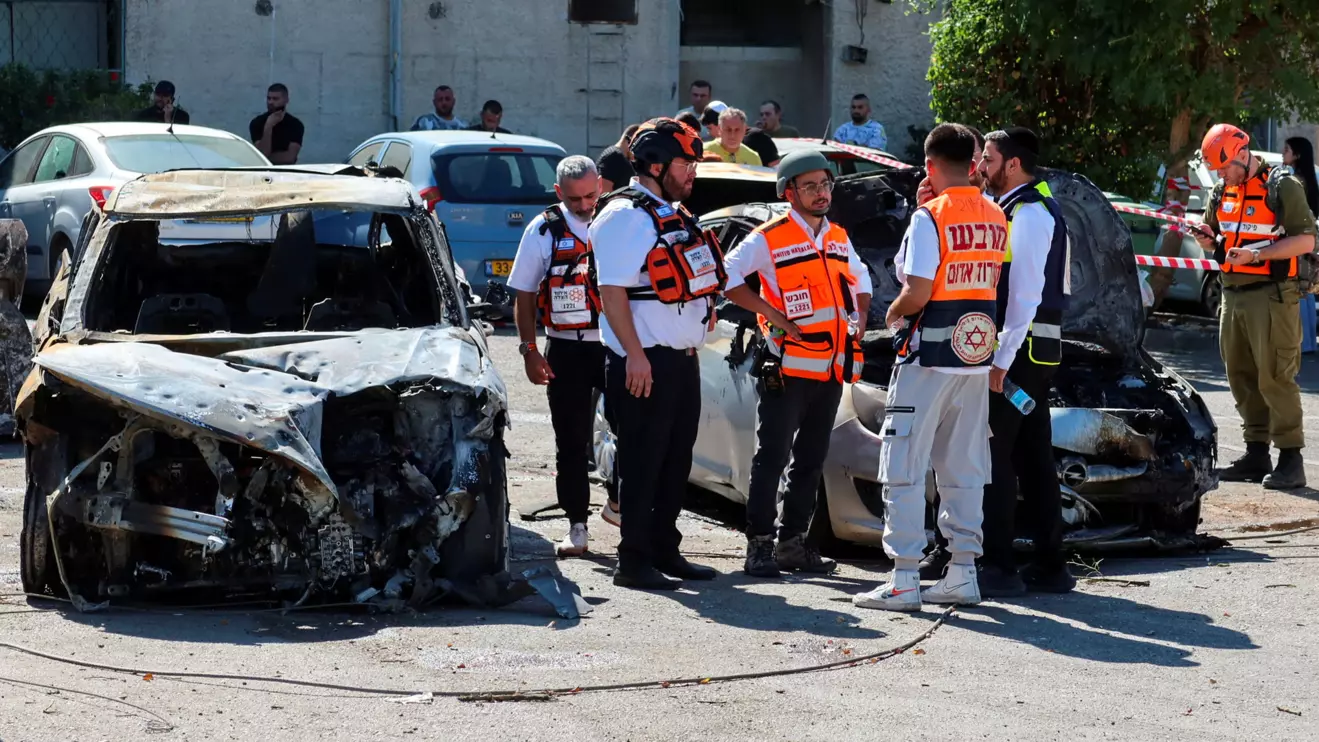 Israeli Home Front Command soldiers and rescue work at an impact scene following rockets that were launched from Lebanon towards Israel, amid cross-border hostilities between Hezbollah and Israel, at an unspecified northern location, October 19, 2024. Reuters/Artorn Pookasook