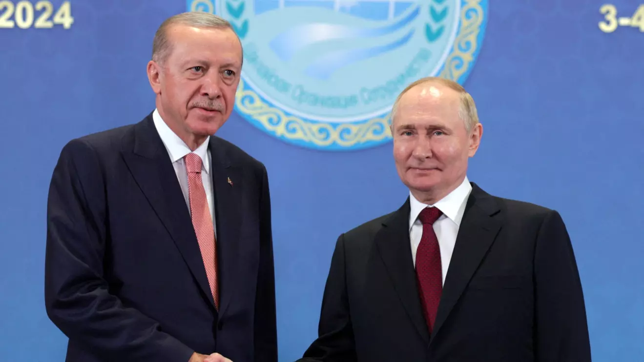 Russian President Vladimir Putin shakes hands with Turkish President Tayyip Erdogan during a meeting on the sidelines of the Shanghai Cooperation Organization (SCO) summit in Astana, Kazakhstan July 3, 2024. Sputnik/Gavriil Grigorov/Pool via Reuters
