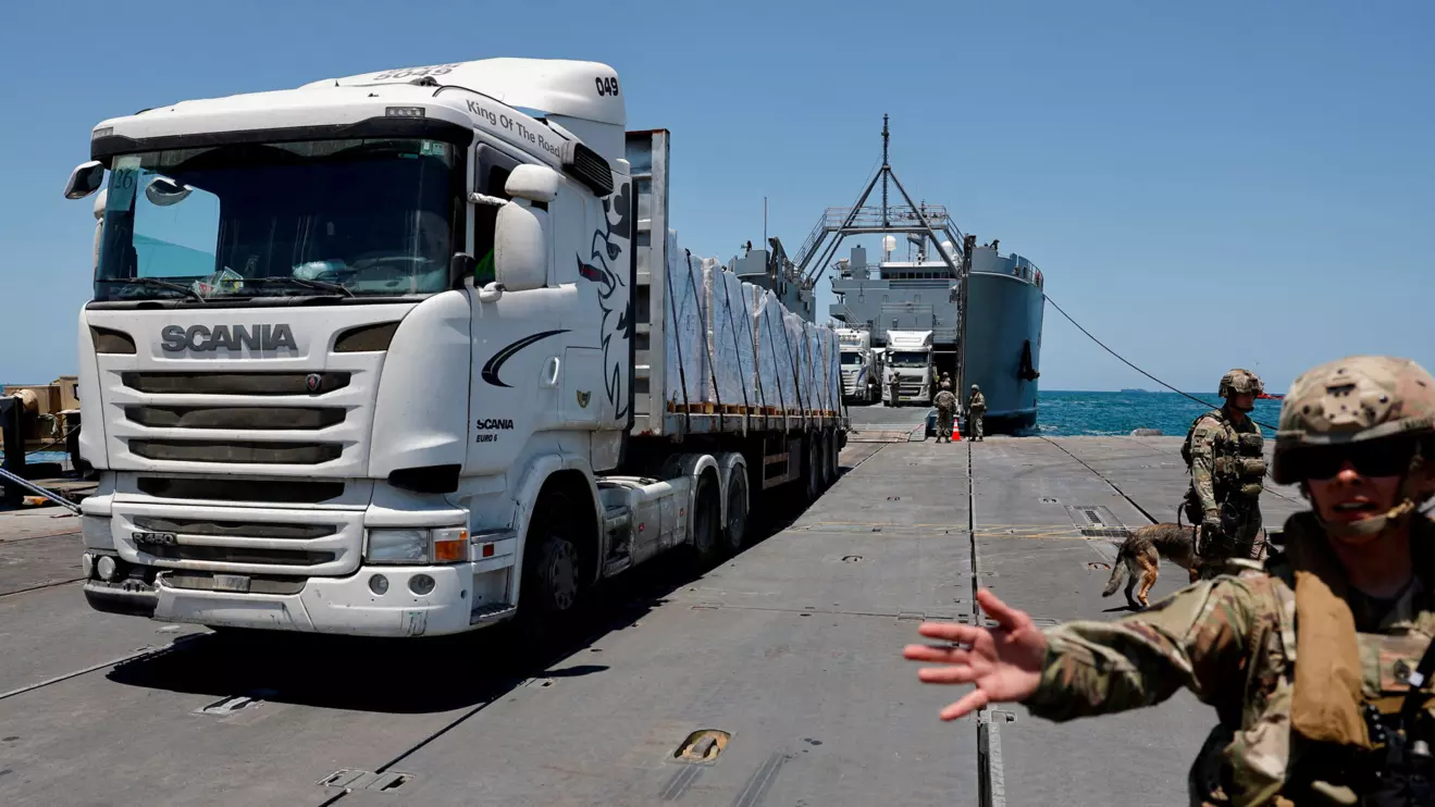 A truck carries humanitarian aid across Trident Pier, a temporary pier to deliver aid, off the Gaza Strip, amid the ongoing conflict between Israel and Hamas, near the Gaza coast, June 25, 2024. Reuters/Amir Cohen