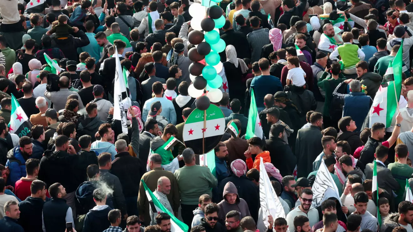 Residents of Hama gather during a protest to mark the first anniversary of the fall of Bashar al-Assad's regime, in Hama, Syria December 5, 2025. Reuters/Mahmoud Hassano