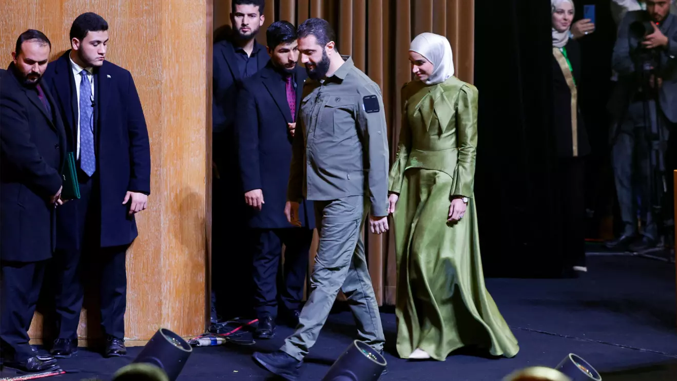 Syria's President Ahmed al-Sharaa walks with his wife Latifa al-Droubi, on the first anniversary of Bashar al-Assad's fall, in Damascus, Syria December 8, 2025. Reuters/Khalil Ashawi