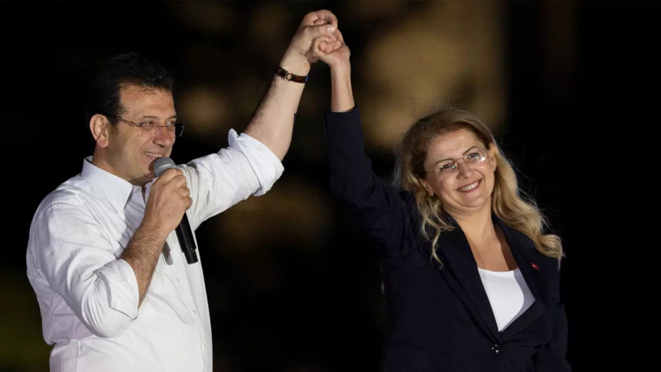 Istanbul's Mayor Ekrem Imamoglu and the main opposition Republican People's Party (CHP) Bakirkoy district mayoral candidate Aysegul Ovalioglu greet their supporters as they celebrate their election victory in front of the Istanbul Metropolitan Municipality (IBB) in Istanbul, April 1, 2024. Reuters/Umit Bektas