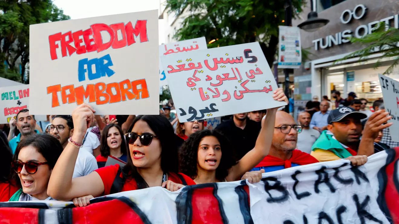 Demonstrators carry a banner during a protest against Tunisia's President Kais Saied, two days before the presidential election, in Tunis, Tunisia October 4, 2024. Reuters/Zoubeir Souissi
