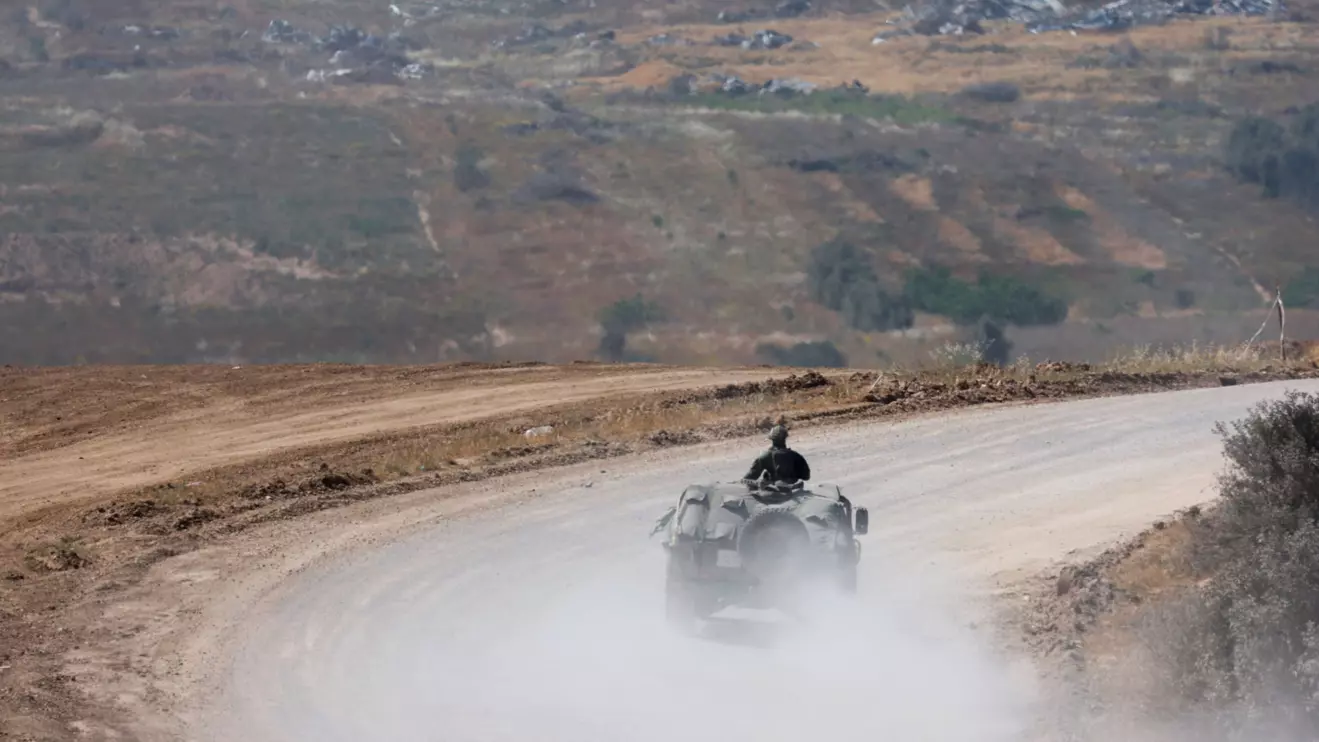 An Israeli military vehicle manoeuvres, near the Israel-Gaza border, amid the ongoing conflict between Israel and the Palestinian Islamist group Hamas, in Israel, April 15, 2024. Reuters/Amir Cohen