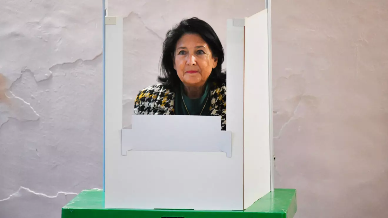 Georgia's President Salome Zourabichvili stands in a voting booth at a polling station during parliamentary elections in Tbilisi, Georgia October 26, 2024. Reuters/Zurab Javakhadze