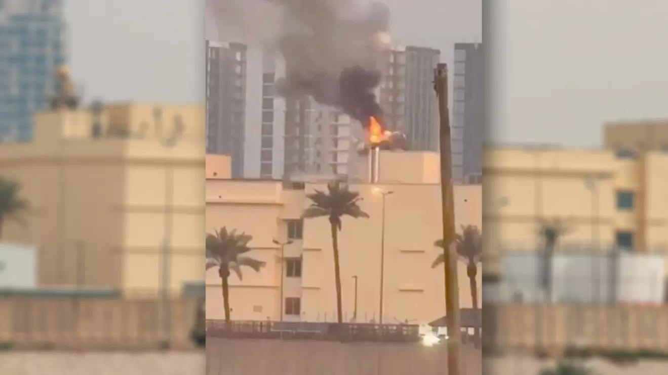 Smoke rises from the U.S. embassy building, after Iraqi security sources said the embassy was hit in a missile attack, in Baghdad, Iraq March 14, 2026 in this screen grab obtained from a social media video